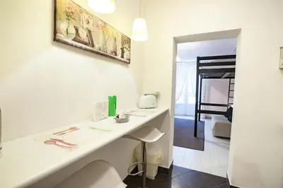 a bathroom with a white counter and a sink at Trip Rooms in Palermo