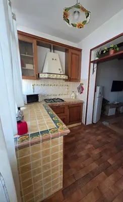 a kitchen with a counter top in a room at PTA Appartamento Girasole in Palermo