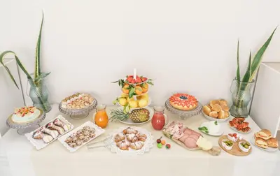 a table with a bunch of different types of food at Oasi del Golfo Suites B&B in Castellammare del Golfo