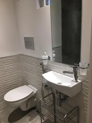 a bathroom with a toilet and a sink at Baru's House in Palermo
