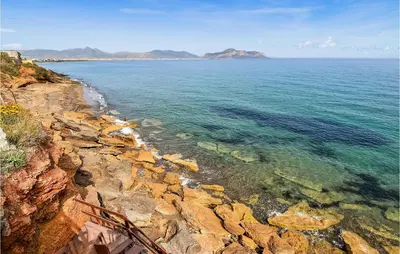 a view of the ocean from a cliff at Villa Mucera in Ficarazzi