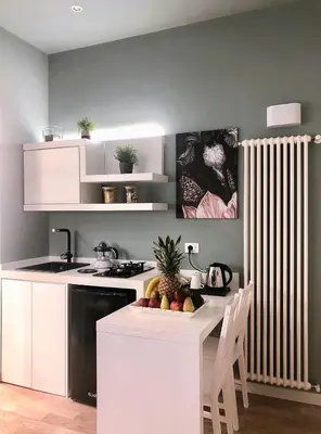 a kitchen with a table with fruit on it at Residenze Chamur Via Giuseppe Sciuti in Palermo