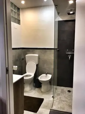a bathroom with a toilet and a sink at B&B Atlante in Palermo