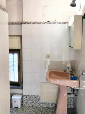 a bathroom with a pink sink and a mirror at Charming Villa in Monreale with Private Pool in Pioppo