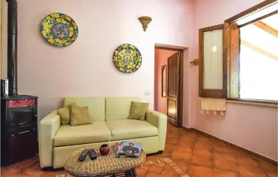 a living room with a couch and a table at Lovely Home In Makari-S Vito Lo Capo in Macari