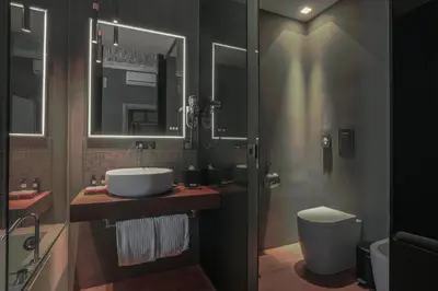 a bathroom with a sink and a toilet at Palco Noir! in Palermo
