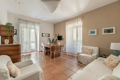 a living room with two couches and a table at Una Finestra sul Teatro Massimo by Wonderful Italy in Palermo
