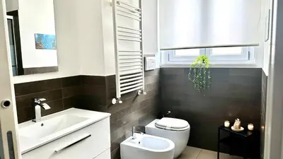 a bathroom with a white sink and a shower at Location10 in Palermo