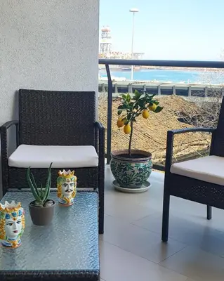 a table with food on top of a balcony at Location10 in Palermo