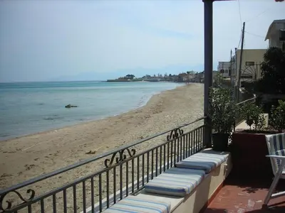 a view of the beach from a balcony at Terrazza sul mare in Trabia