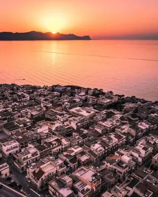 an aerial view of a city in front of the water at Giardini Del Golfo in Balestrate