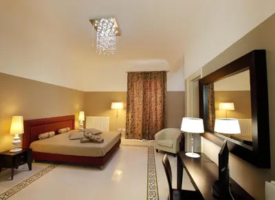 a bedroom with a bed and a large mirror at Abatellis Luxury in Palermo