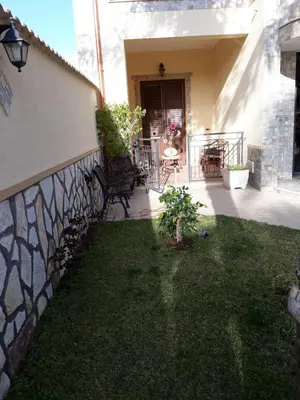 a house with a yard with a fence at Paradise in Palermo