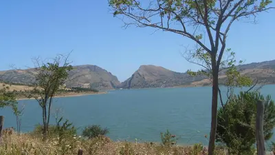a view of a lake with mountains in the background at Casa Vacanze Caccamo Santa Lucia in Caccamo