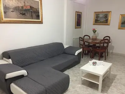 a living room with a couch and a table at Casa Mia in Altavilla Milicia