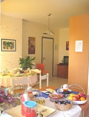 a kitchen with a table with fruit on it at Costapicca in Alcamo