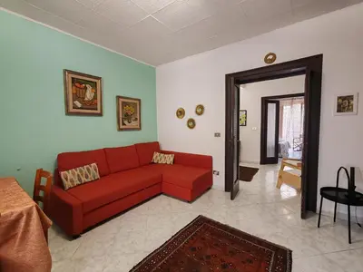 a living room with a door leading to a living room at 4 passi Casa Vacanza in Palermo