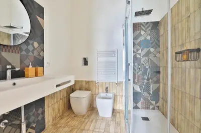 a bathroom with a toilet and a shower at Storie di Palermo in Palermo