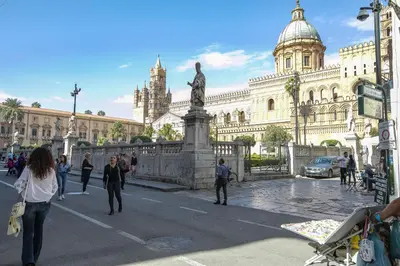a group of people walking in front of a building at Storie di Palermo in Palermo