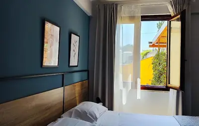 a bedroom with a bed and a window at Bed & Breakfast Tiziana in Castellammare del Golfo