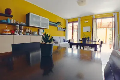 a kitchen and dining room with a large wooden table at Bed & Breakfast Tiziana in Castellammare del Golfo