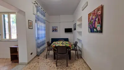 a dining room with a table and chairs at Mondello vista in Mondello
