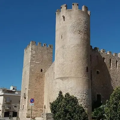 a large castle with two towers on top of it at Alcamo Rooms con GARAGE privato in Alcamo