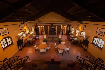 an overhead view of a room with tables and chairs at Masseria Pernice in Monreale