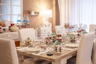 a dining table with christmas decorations on it at Maison de Famille in Palermo