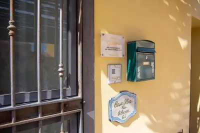 a sign on a wall next to a window at Solemar Sicilia - Casa Olivia in Santa Flavia