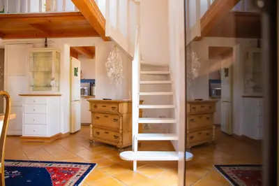 a room with a staircase in a room with cabinets at Solemar Sicilia - Casa Olivia in Santa Flavia