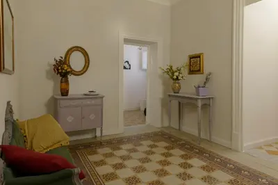 a hallway with a door leading to a kitchen at Opera Prima 28 in Palermo