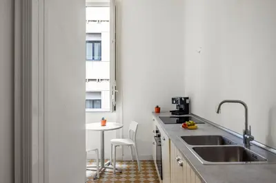 a kitchen with a sink and a table at Palazzo Amazigh in Palermo