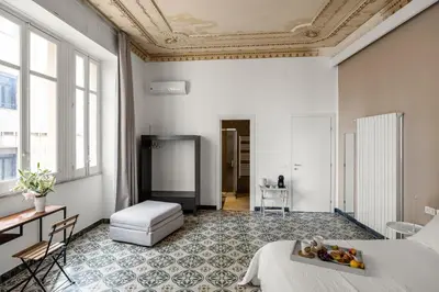 a bedroom with a bed with a tray of fruit on it at Palazzo Amazigh in Palermo
