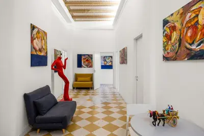 a living room with a woman standing on a wall at Palazzo Amazigh in Palermo