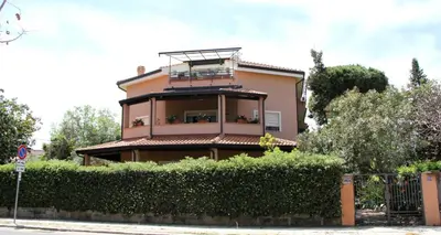 a building with a balcony on top of it at VILLA LEA in Mondello