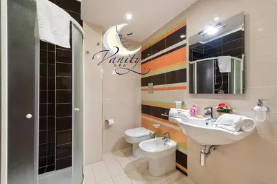 a bathroom with a sink and a toilet at Vanity SPA in Balestrate