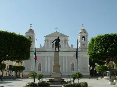 a building with a statue in front of it at Vanity SPA in Balestrate