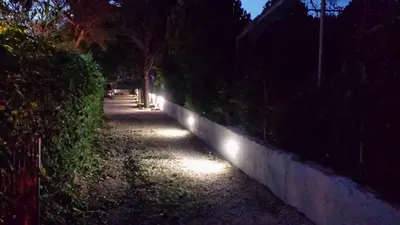 a row of lights on a wall at night at Casa Vacanze Mari in San Vito lo Capo