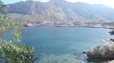 a large body of water with mountains in the background at Casa Vacanze Laura in Isola delle Femmine