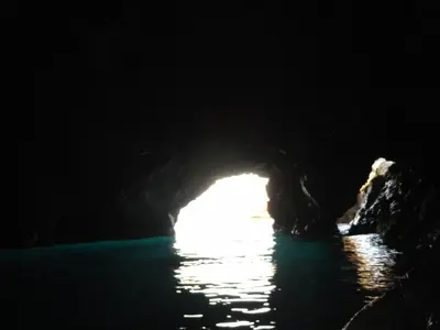 a cave with the light at the end of it at Casa Vacanze Laura in Isola delle Femmine