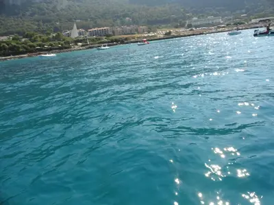 a large body of water with a city in the background at Casa Vacanze Laura in Isola delle Femmine