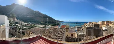 a table with many different types of food and drinks at Badia Rooms & Breakfast in Castellammare del Golfo