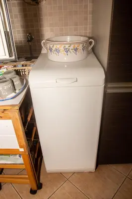 a white refrigerator with a bowl on top of it at Casa Primavera in Palermo