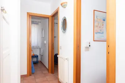 a hallway with a door leading to a room at Casa Ponente con Vista Mare a Macari in Macari