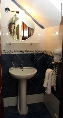 a bathroom with a sink and a mirror at Donna Lia in Bagheria