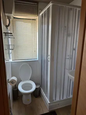 a bathroom with a toilet and a sink at Casa Rosina in Palermo
