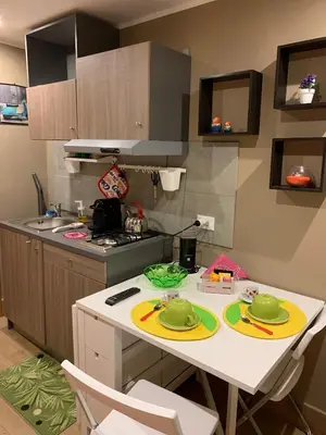 a kitchen with a table with plates on it at Casa Rosina in Palermo
