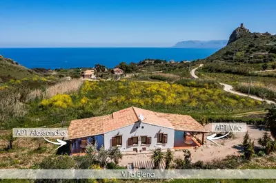 a house on a hill next to the ocean at Villa Elena vicino la Riserva naturale dello Zingaro in Scopello