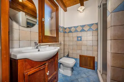 a bathroom with a sink and a toilet at APT Villa Anna e APT Cantina Vito vicinissimi alla Riserva dello Zingaro in Scopello